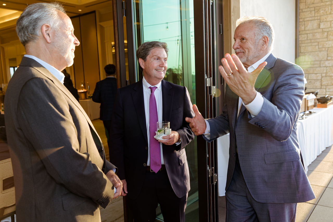 Managing Partner Fred Whitaker networking with guests during Cummins & White’s 75th Anniversary celebration.